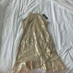 Gold sequence mini dress with a halter neck line.